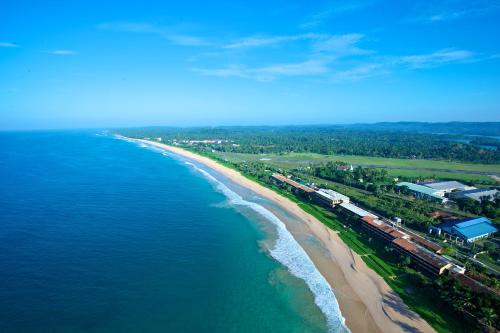an aerial view of a beach and the ocean at The Long Beach Resort & Spa in Koggala