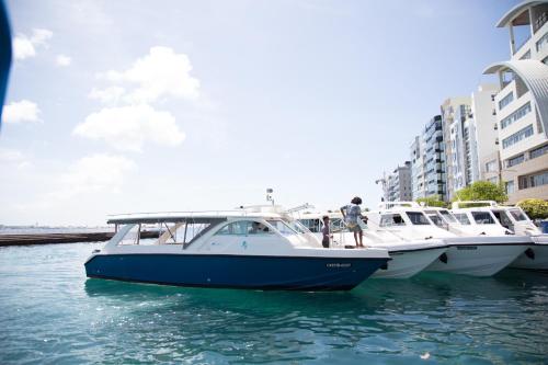 a group of boats parked in the water at Villa Rosa Maldives in Feridhoo