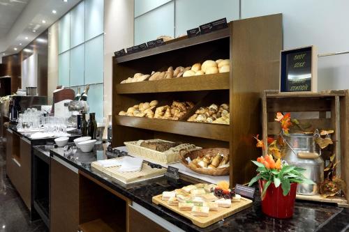 a bakery with bread and pastries on a counter at Eurostars Berlin in Berlin