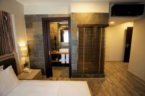 Katil atau katil-katil dalam bilik di Gelibolu Taş Konak Hotel