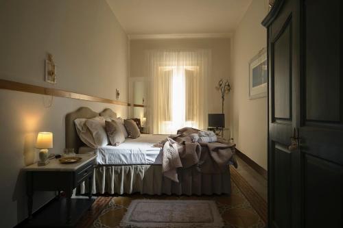 Una cama o camas en una habitación de Ai Lumi