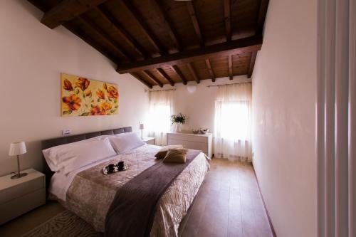 a bedroom with a bed in a room with a window at Arena Dreams Apartment in Verona