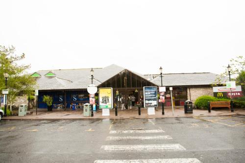 a parking lot in front of a building at Days Inn Kendal - Killington Lake in Kendal