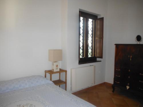 Кровать или кровати в номере Alloggio Turistico Ciliegi in Fiore
