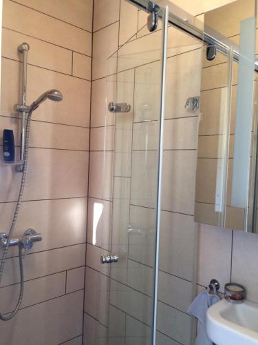 a bathroom with a shower and a sink at TIHANY (BALATON), BEST VIEW, SPACIOUS WELLNESS, CENTRAL , 50m BEACH in Tihany