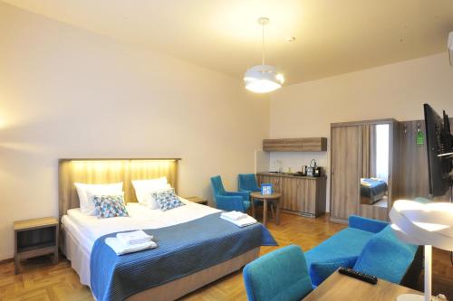 
Łóżko lub łóżka w pokoju w obiekcie Kosmopolita Apartments
