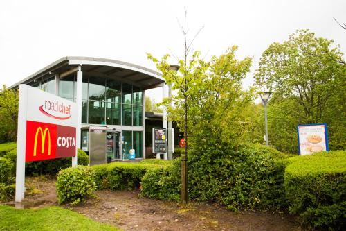 a mcdonalds building with a sign in front of it at Days Inn Stafford in Stafford