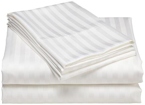 a stack of white towels on a white background at Kenz Residency in Cochin