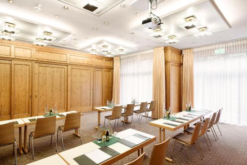 a conference room with tables and chairs in it at Bauer Hotel und Restaurant in Feldkirchen