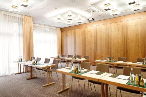 a large room with tables and chairs in it at Bauer Hotel und Restaurant in Feldkirchen