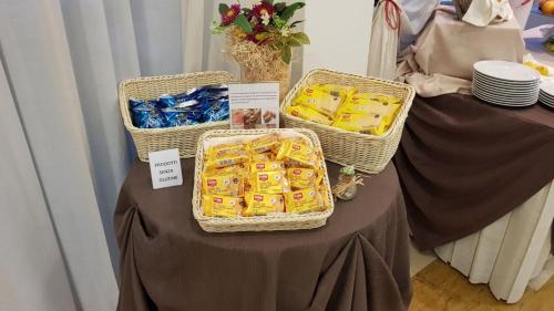 a table with three baskets of food on it at Hotel Majorca sul Mare in centro a Riccione con Area Fitness in Riccione
