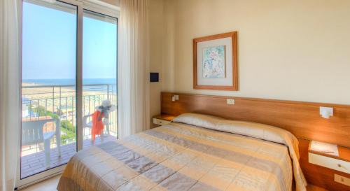 Postel nebo postele na pokoji v ubytování Hotel Ancora