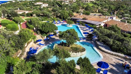 an aerial view of a pool at a resort at Colonna Country Club in Porto Cervo
