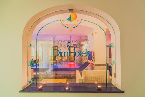 a store window with a sign that reads stop dint idiots at Aragona Palace Hotel & Spa in Ischia
