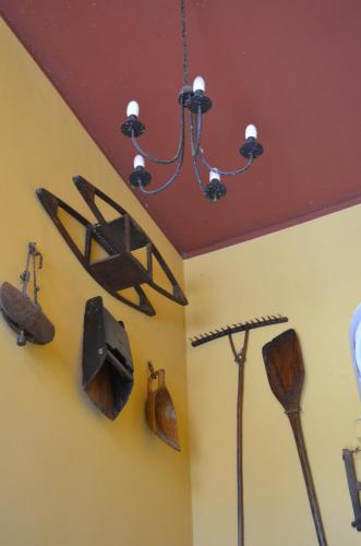 a room with various utensils hanging on the wall at Agriturismo Cascina Maiocca in Mediglia