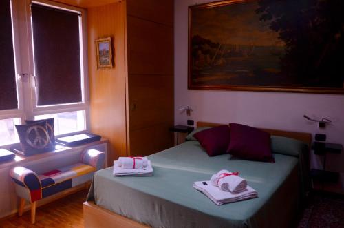 A bed or beds in a room at EcoHouse & BioVeg Café