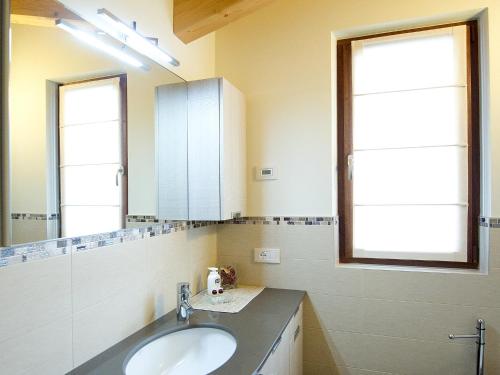 a bathroom with a sink and a mirror at Casa Reit in Bormio