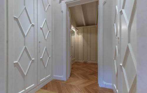 an empty hallway with white walls and wooden floors at Villa Rinaldi in Montespertoli