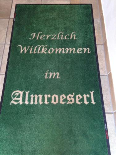a green rug with the words herbal will informant im administrator at Almroeserl in Mittenwald