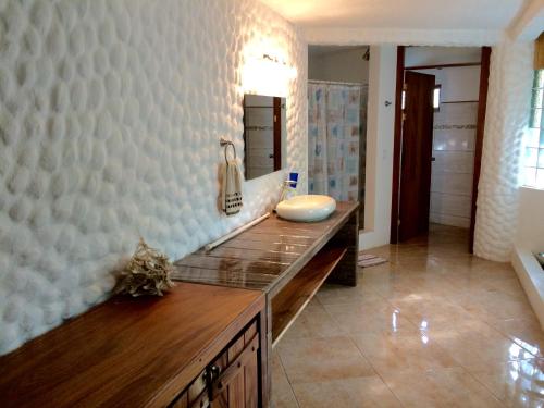 a bathroom with a counter with a sink in it at Villas la Paz in Playa Conchal