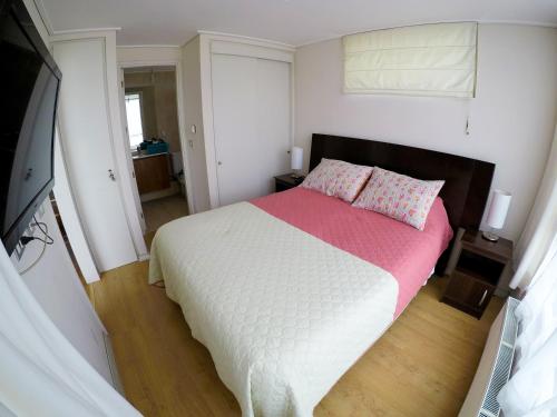 En eller flere senge i et værelse på Marina Poniente Apartment