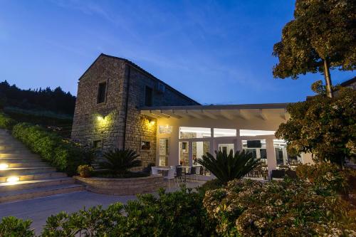 a house with a stone building with lights at Hotel Ristorante Solelago in Guardialfiera