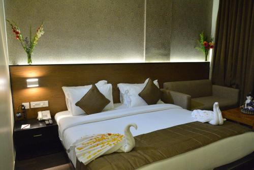Ένα ή περισσότερα κρεβάτια σε δωμάτιο στο Hotel Sree Annamalaiyar Park