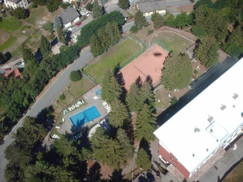 an overhead view of a park with trees and a pool at Grand Hotel SIVA - Adults Only in Santo Stefano dʼAveto
