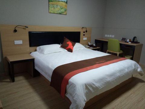 Katil atau katil-katil dalam bilik di JUNYI Hotel Niongbo Xiangshan Bus Station