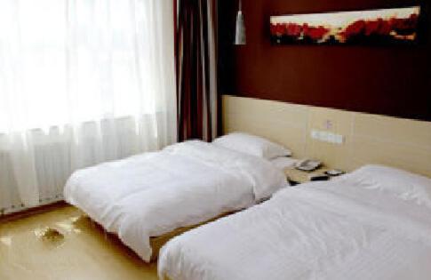 two white beds in a room with a window at Thank Inn Chain Hotel Shandong Dezhou South City in Dezhou