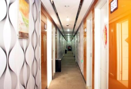 a hallway of an office building with a long corridor at Thank Inn Chain Shandong Zaozhuang Taierzhuang Gucheng Development Area Rapid Bus Station in Zhaozhuang