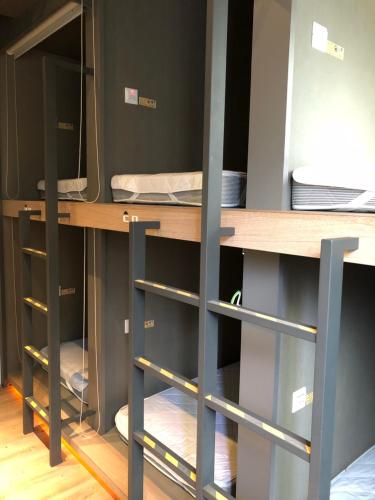 a room with two bunk beds in a room at Taipei Discover Hostel in Taipei
