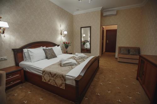 
Кровать или кровати в номере Отель Вилладжио
