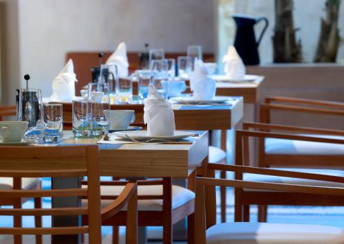 
a dining room filled with tables and chairs at Elia Fatma Boutique Hotel in Chania Town
