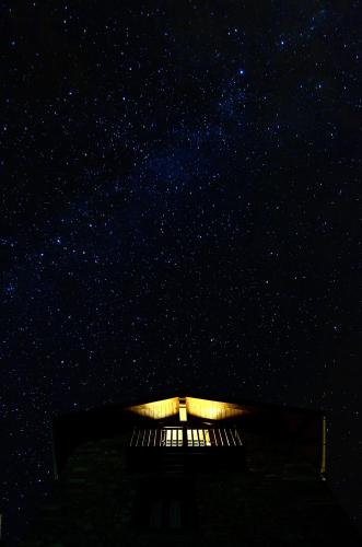 a building with a starry sky in the background at Argonz Etxea in Urzainqui