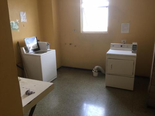 a room with two machines and a window at Worthington Towers Apartment in Kingston