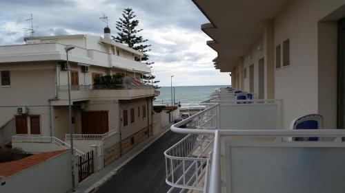 a view of the ocean from the balcony of a ship at Hotel Miramare in Marina di Ragusa