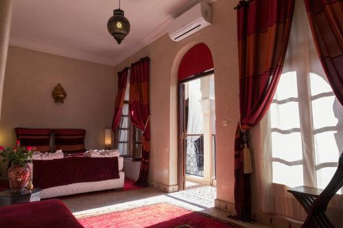 מיטה או מיטות בחדר ב-Riad Djemanna