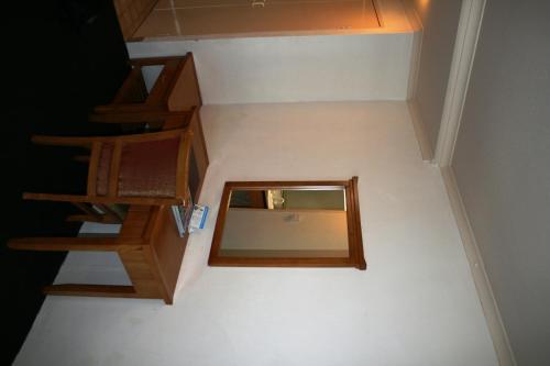 a mirror sitting on the floor next to a staircase at Luma Luma Holiday Apartments in Darwin