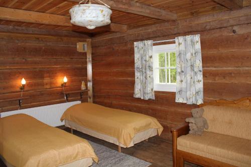 מיטה או מיטות בחדר ב-Nukula Guestrooms