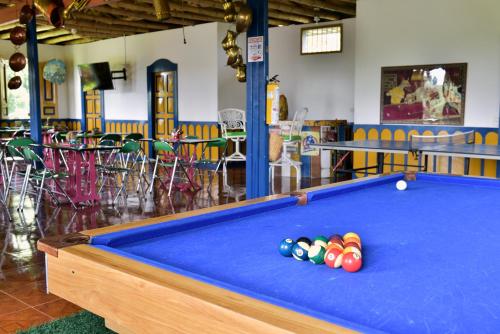 a pool table with balls on top of it at Finca Hotel Los Girasoles in Montenegro
