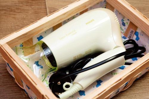 a bottle of wine in a wooden box at You&I Guesthouse in Jeju