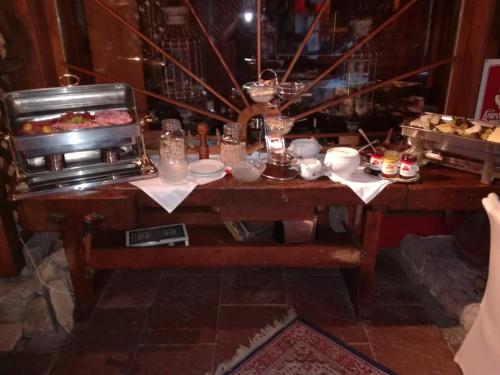 a table with a buffet of food on it at Alte Schreinerei-Auberge Harlekin in Singen