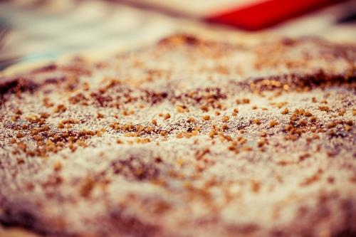 a close up of a piece of bread with spices on it at SAKS Urban Design Hotel Kaiserslautern in Kaiserslautern