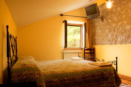 A bed or beds in a room at Agriturismo Falode