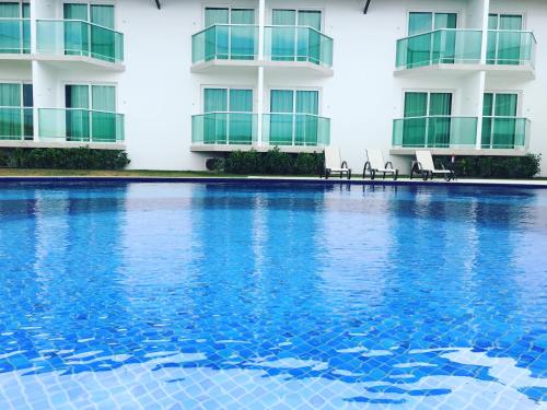 a swimming pool in front of a building at Reserve Hotel in Surubim