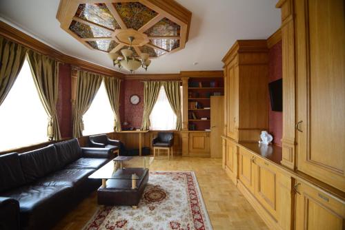 a living room with a couch and a table at Pidkova in Rivne