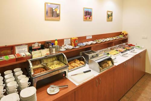 a buffet line in a restaurant with food at Penzion Krumlov - Massage studio in Český Krumlov