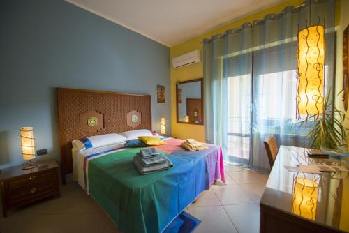 Postel nebo postele na pokoji v ubytování Dolce Conca D'Oro B&B