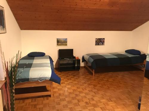 Postel nebo postele na pokoji v ubytování Bed n Breakfast Obermumpf